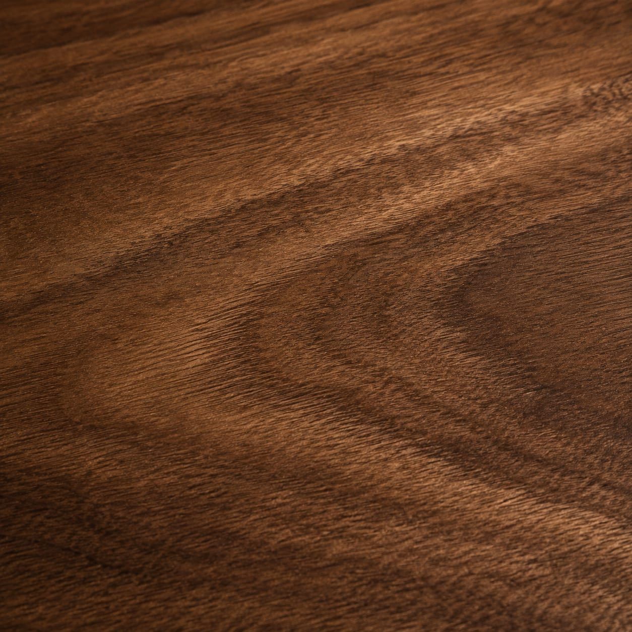 A walnut panel with dark figured grain
